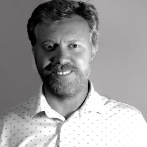 Professional headshot with a confident approachable expression