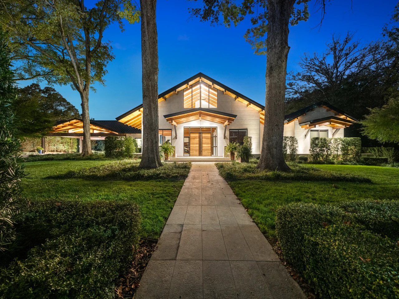 Luxury Raleigh home photographed at twilight with warm interior light
