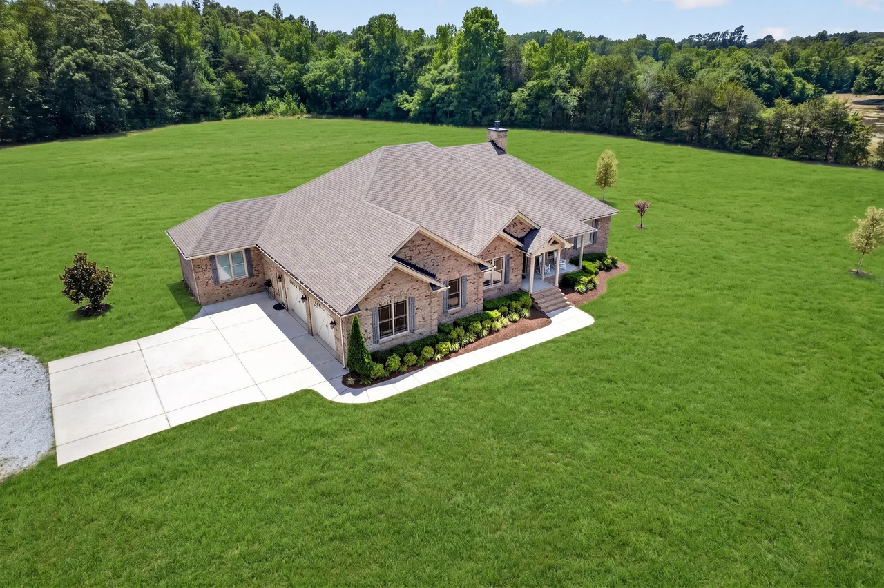 Wide aerial view showing the Pentecost residence and surrounding land