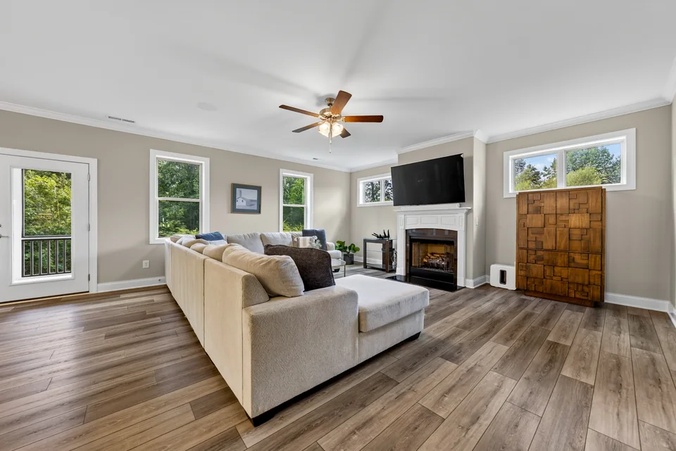 Living room with fireplace and large windows