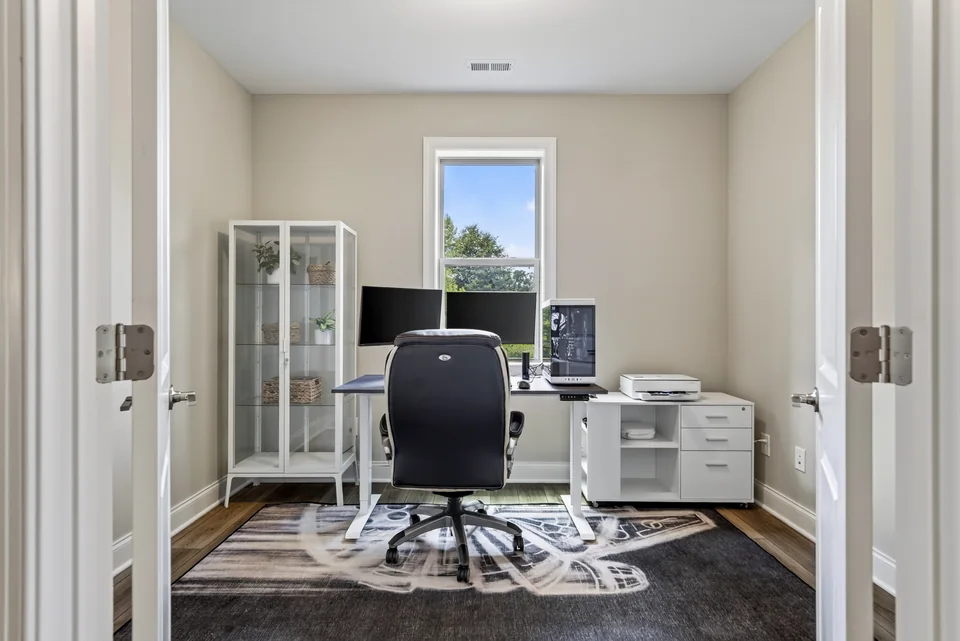 Compact home office with a desk and display cabinet