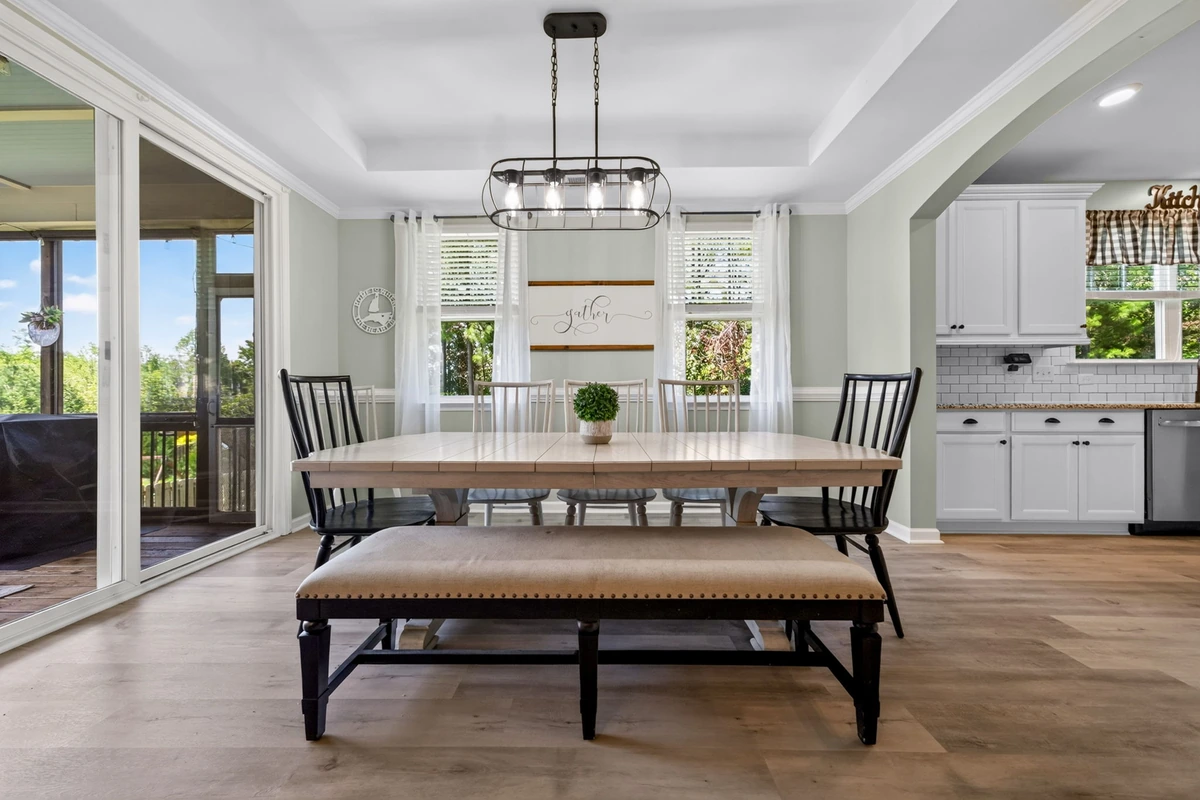 Rolesville dining room with windows and a set table