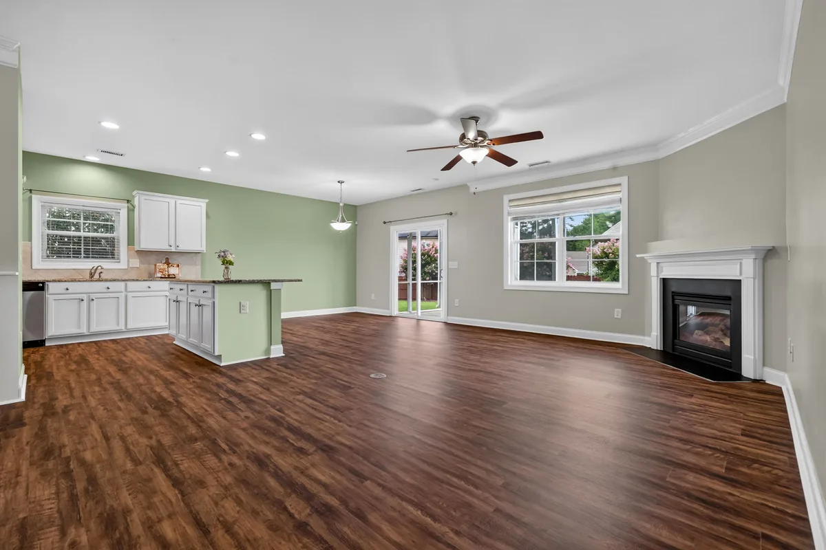 Unfurnished Raleigh living area showing its connection to the kitchen