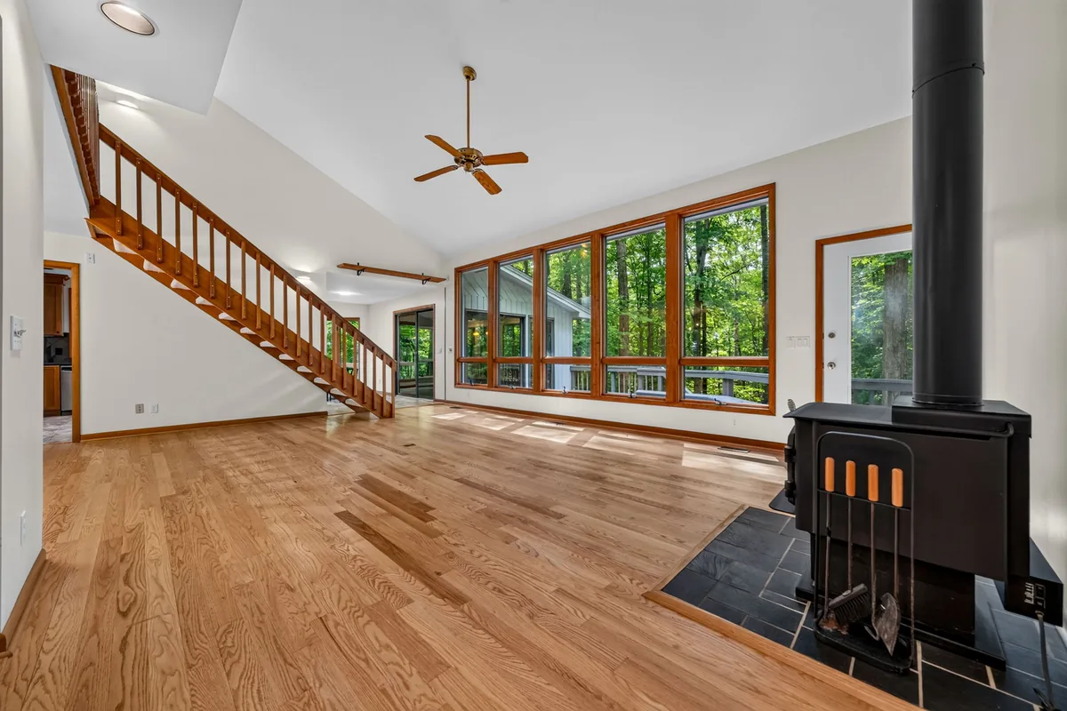 Open Garner living room showing windows, fireplace, and circulation