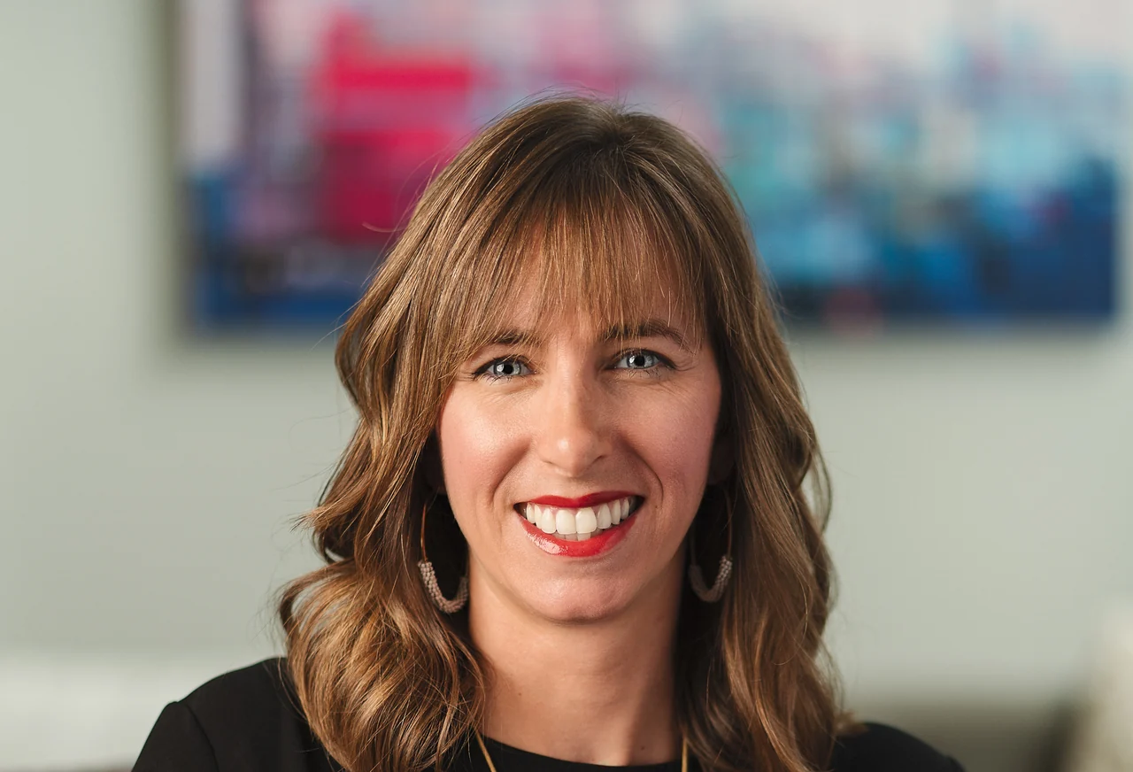 Professional client headshot with a warm, approachable expression