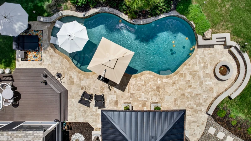 Aerial view of a Ridgebrook Bluffs property with a swimming pool and surrounding grounds